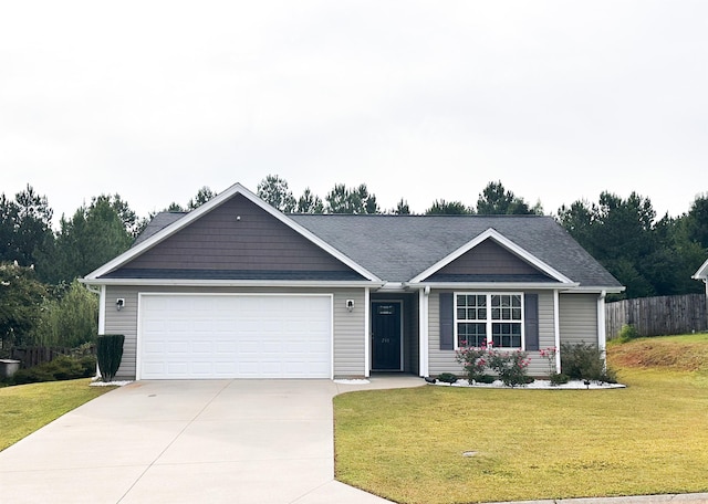 view of front facade featuring a garage and a front yard