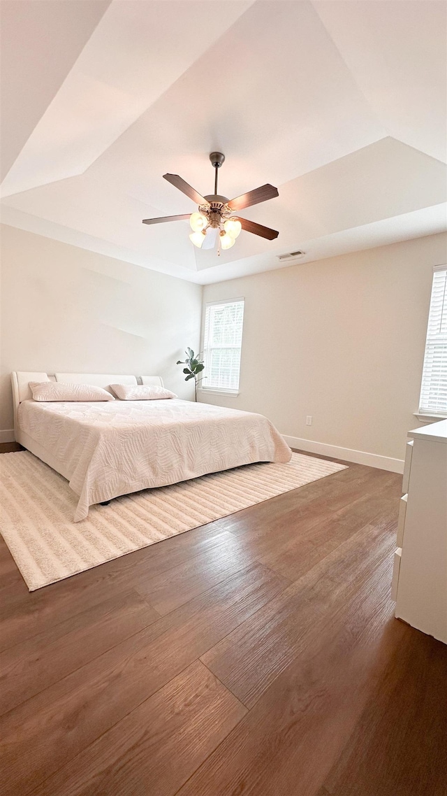 unfurnished bedroom with wood-type flooring and ceiling fan