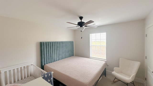 carpeted bedroom featuring ceiling fan