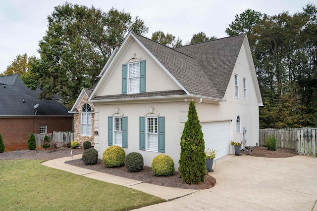 view of front facade featuring a garage and a front lawn