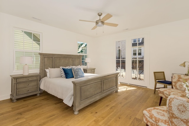 bedroom with ceiling fan, access to exterior, and light hardwood / wood-style flooring