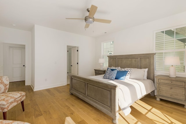 bedroom with ceiling fan and light hardwood / wood-style floors