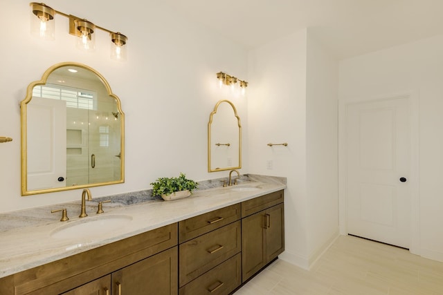 bathroom featuring vanity and a shower with shower door