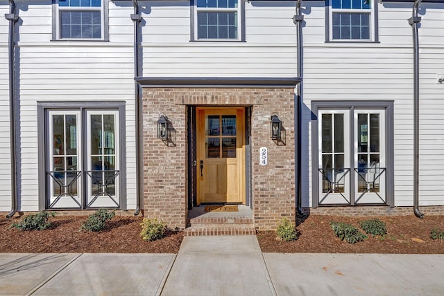 property entrance featuring french doors