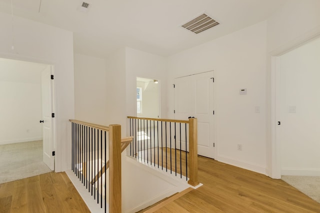 corridor with wood-type flooring