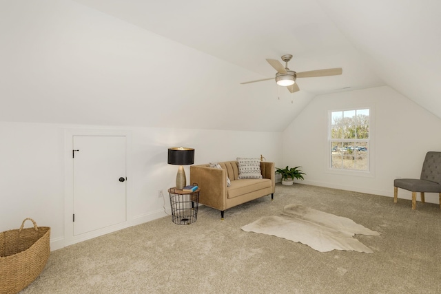 sitting room featuring light carpet, vaulted ceiling, and ceiling fan