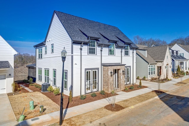 multi unit property featuring a garage and central AC