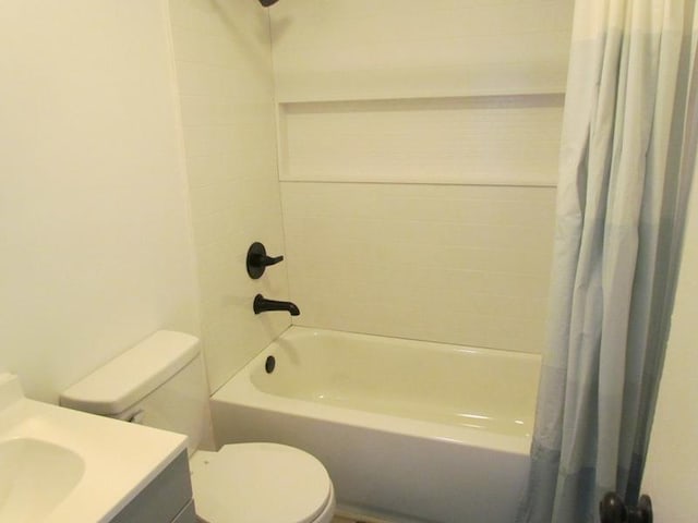 full bathroom with vanity, toilet, and shower / tub combo