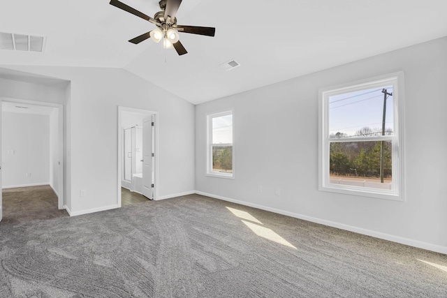 unfurnished bedroom featuring vaulted ceiling, ceiling fan, and dark colored carpet