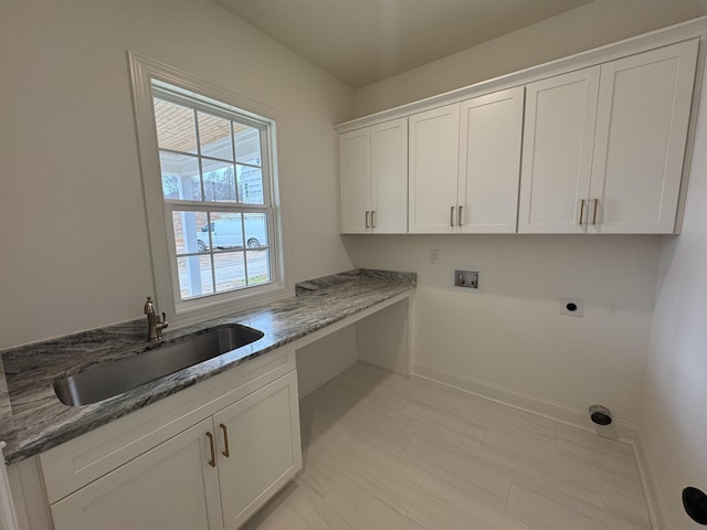 washroom featuring cabinets, hookup for an electric dryer, sink, and washer hookup