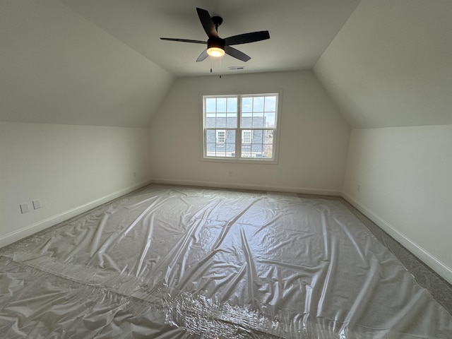 additional living space featuring vaulted ceiling and ceiling fan