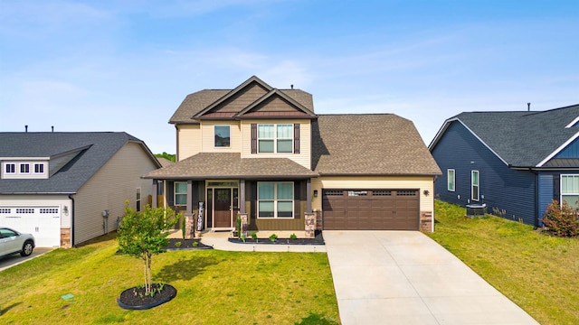 craftsman-style home featuring a garage, a front yard, central air condition unit, and covered porch