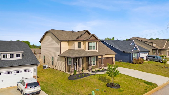 craftsman inspired home featuring a porch, a garage, a front yard, and central AC unit