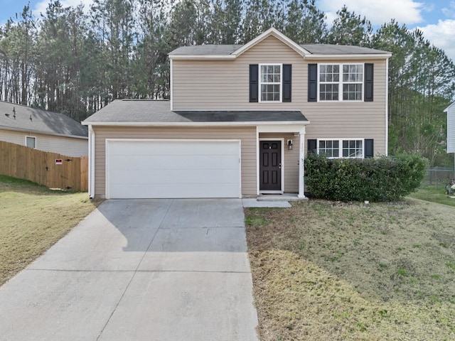 view of front of property with a garage and a front lawn