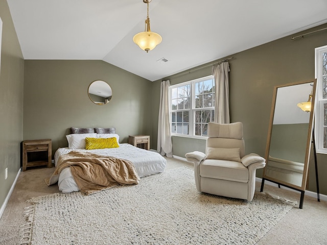 carpeted bedroom featuring lofted ceiling