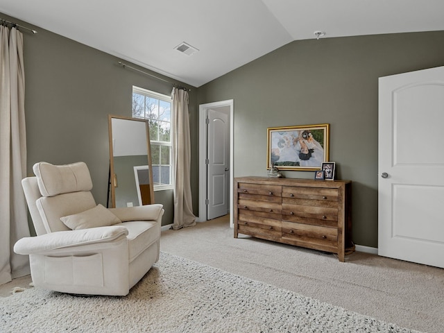 living area with lofted ceiling and carpet floors