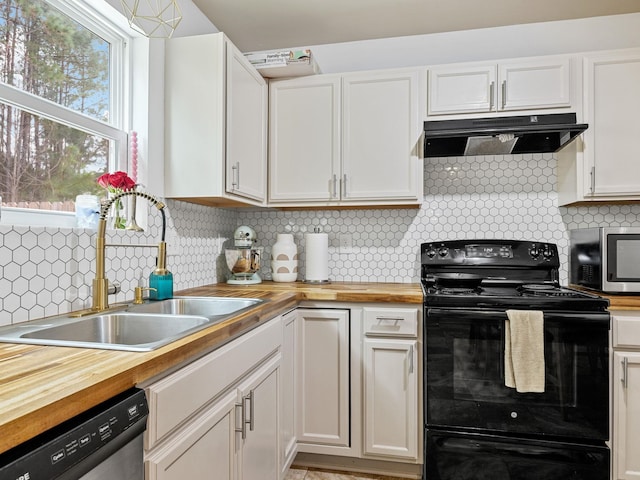 kitchen with white cabinets, stainless steel appliances, exhaust hood, and wooden counters