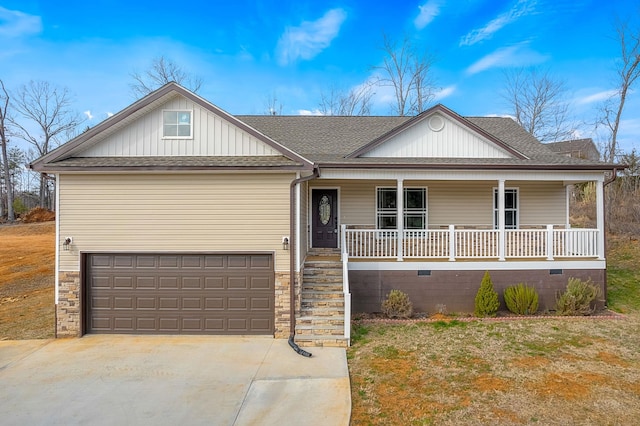 view of front of home with a garage, covered porch, and a front yard