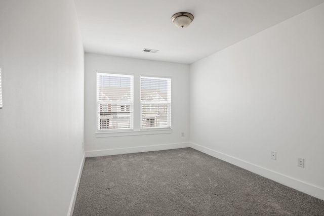 unfurnished room with carpet floors