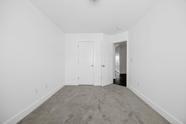 unfurnished bedroom with light carpet