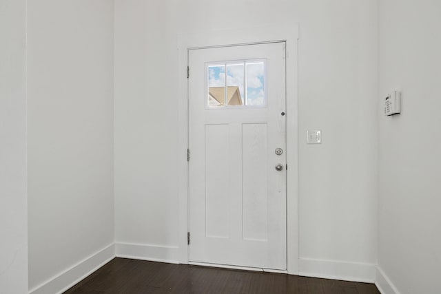 entryway with dark wood-type flooring