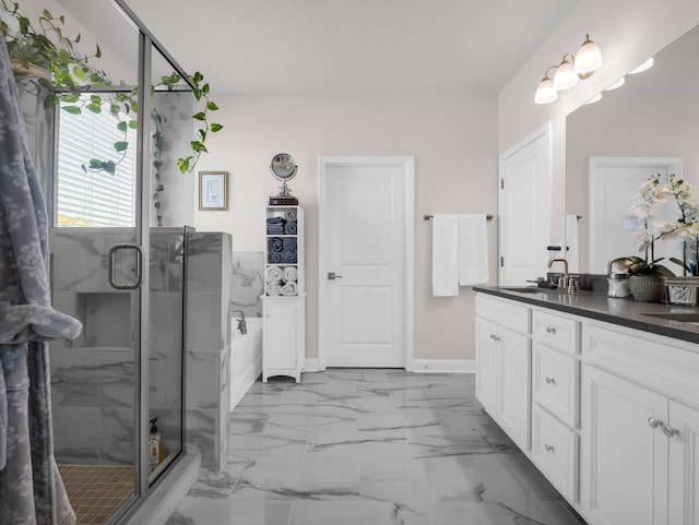 bathroom with vanity and a shower with door