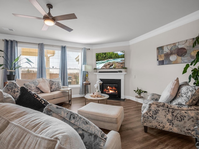 living room featuring crown molding, ceiling fan, and dark hardwood / wood-style flooring