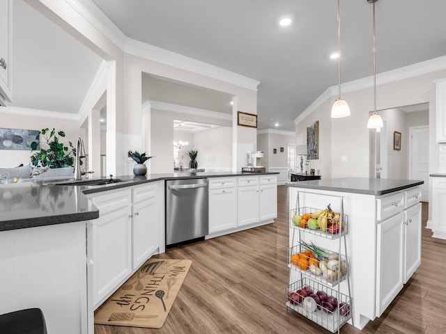 kitchen featuring sink, dishwasher, white cabinetry, hanging light fixtures, and a center island