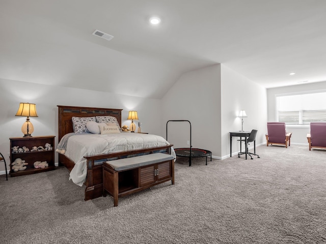 carpeted bedroom with lofted ceiling