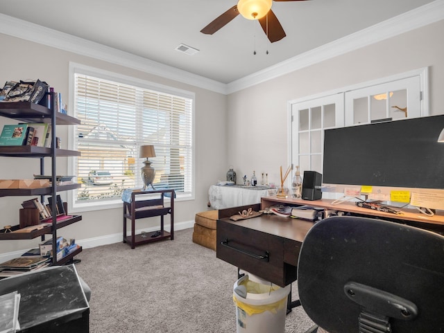 carpeted office featuring crown molding and ceiling fan