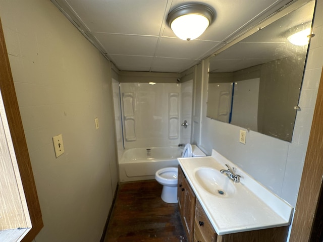 full bathroom with hardwood / wood-style flooring, vanity, shower / washtub combination, and toilet