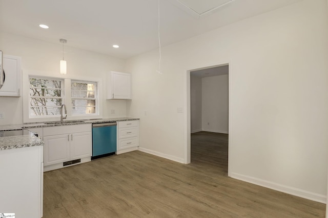 kitchen with sink, decorative light fixtures, stainless steel dishwasher, dark hardwood / wood-style floors, and white cabinets