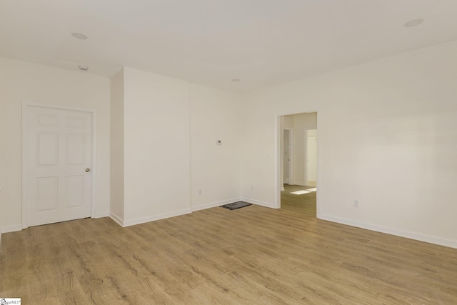 spare room featuring light hardwood / wood-style flooring