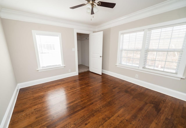 unfurnished bedroom featuring dark hardwood / wood-style flooring, ornamental molding, a closet, and ceiling fan
