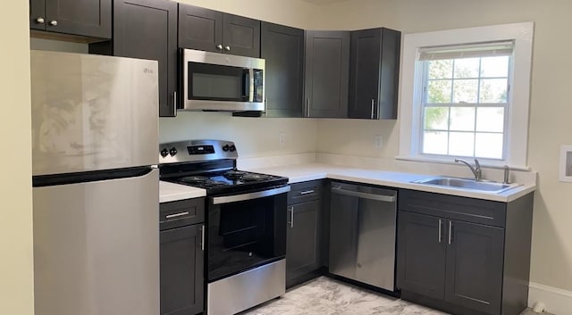 kitchen featuring stainless steel appliances and sink