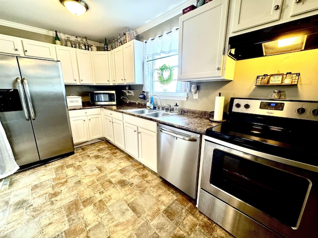 kitchen with white cabinetry, appliances with stainless steel finishes, sink, and range hood