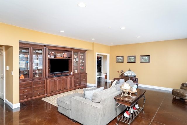 living room with dark tile patterned floors