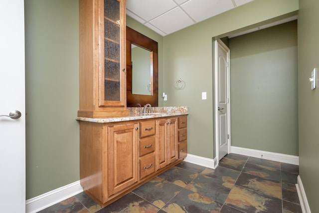 bathroom featuring vanity and a paneled ceiling