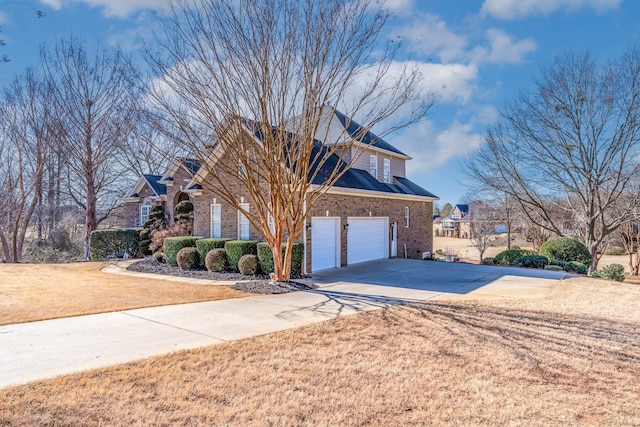 front of property with a garage and a front yard