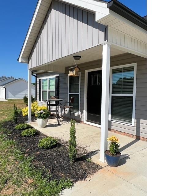 back of house with covered porch