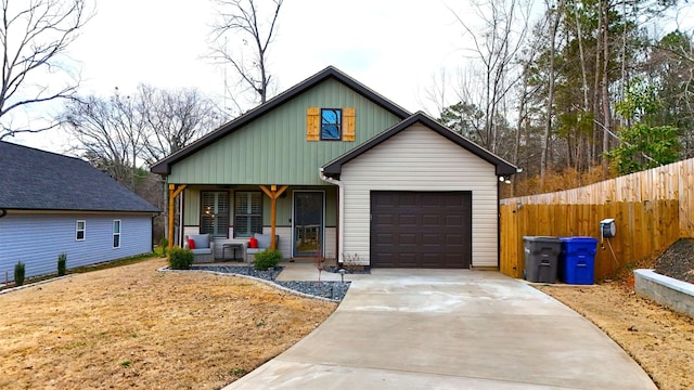 view of front facade with a garage and a porch