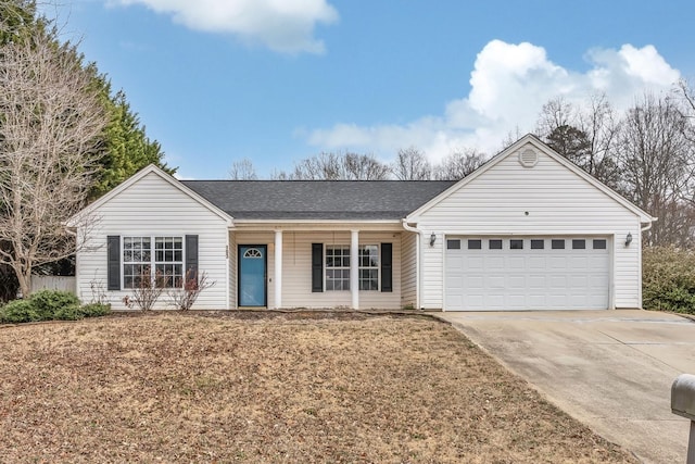 ranch-style home with a garage and a front lawn