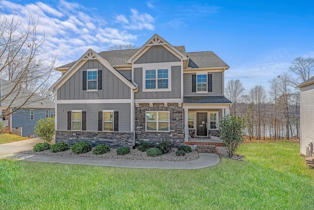 craftsman-style house featuring a front yard