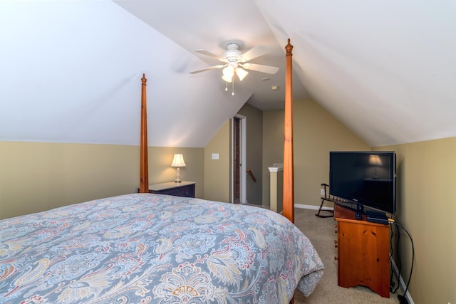 bedroom featuring light carpet, vaulted ceiling, and ceiling fan