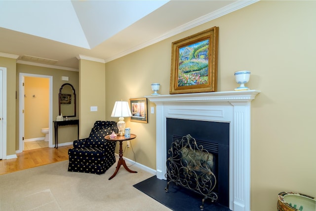 sitting room featuring crown molding and carpet flooring