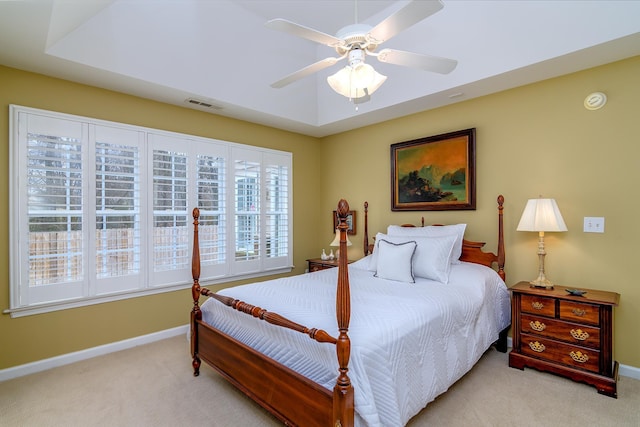 bedroom with ceiling fan and light colored carpet