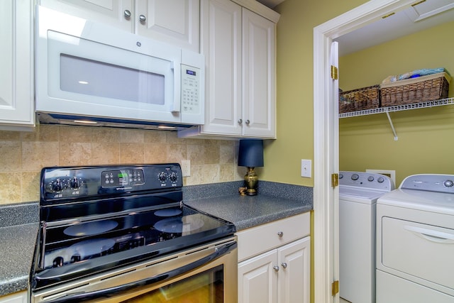 kitchen featuring tasteful backsplash, white cabinets, and stainless steel range with electric stovetop