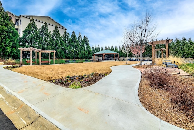 view of home's community with a gazebo and a pergola