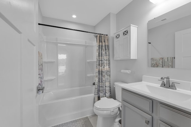 full bathroom with shower / bath combination with curtain, vanity, and toilet