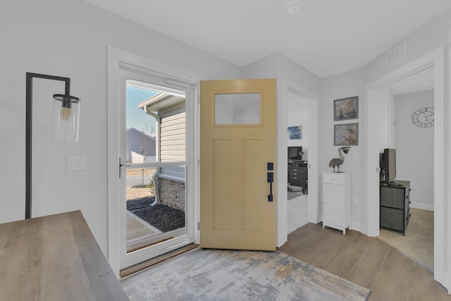 entrance foyer with light wood-type flooring